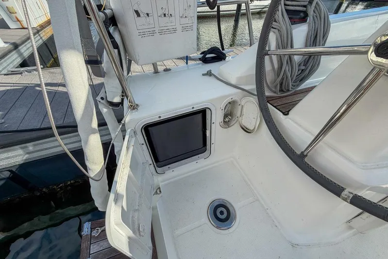 Coastal Distancing Yacht Photos Pics Cockpit of 2021 Beneteau Oceanis 30.1 sailboat with steering wheel and control panel.