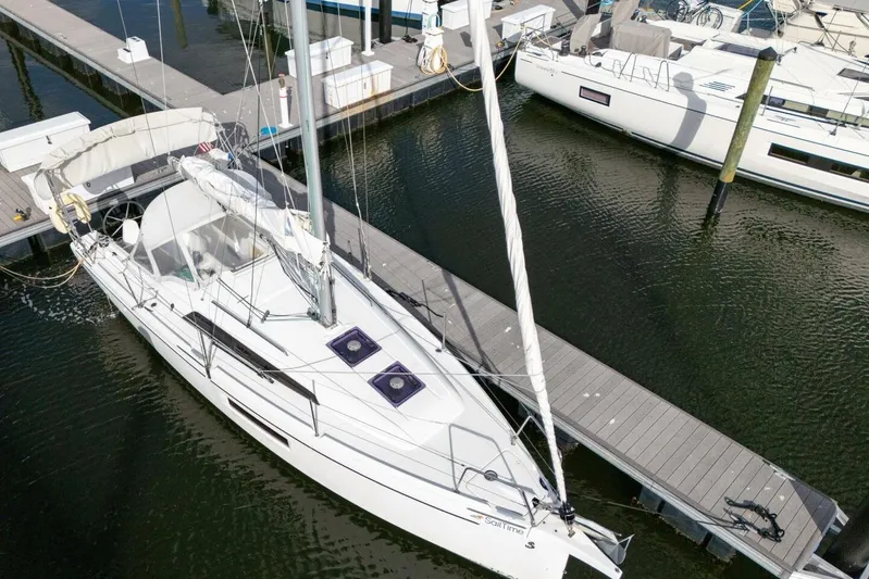 Coastal Distancing Yacht Photos Pics 2021 Beneteau Oceanis 30.1 sailboat docked at marina, aerial view.