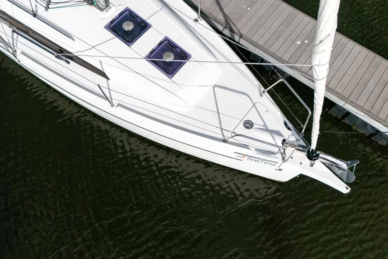 Coastal Distancing Yacht Photos Pics Aerial view of 2021 Beneteau Oceanis 30.1 sailboat docked on calm water.