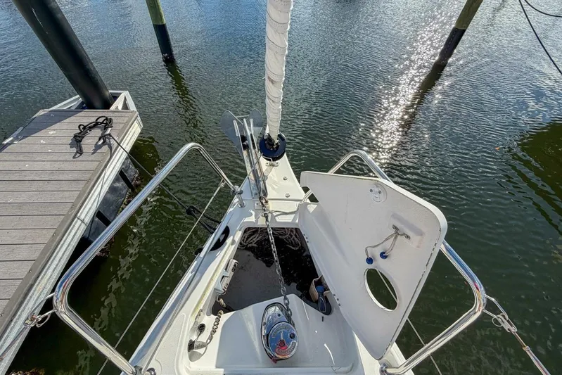 Coastal Distancing Yacht Photos Pics Beneteau Oceanis 30.1 sailboat bow, docked, with open anchor locker, 2021 model.