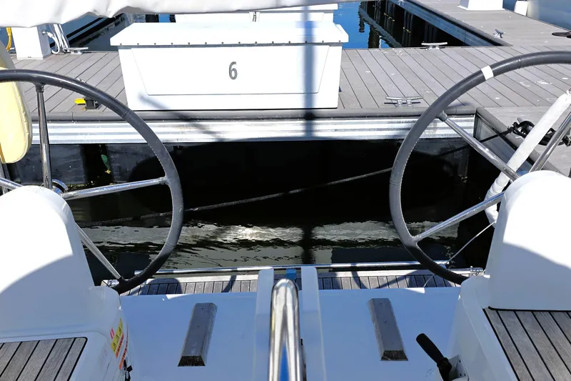 Coastal Distancing Yacht Photos Pics Beneteau Oceanis 30.1 yacht cockpit view, dual steering wheels, docked at marina.