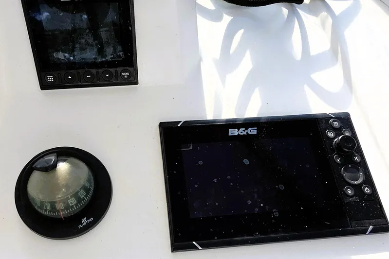 Coastal Distancing Yacht Photos Pics Navigation instruments on a 2022 Beneteau Oceanis 30.1 yacht, featuring a compass and B&G display.