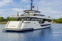 Luxurious 2023 Custom Line CL106 yacht on serene water, featuring sleek modern design.