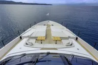 Luxurious 2023 Custom Line CL106 yacht deck with elegant seating, overlooking serene ocean waters.