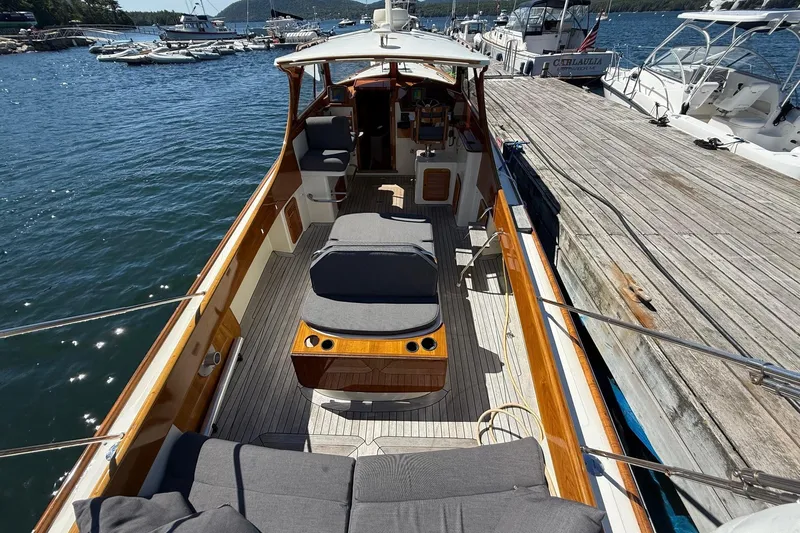 Timothy E Yacht Photos Pics 2001 Hinckley Classic Picnic Boat docked, featuring spacious deck and comfortable seating.