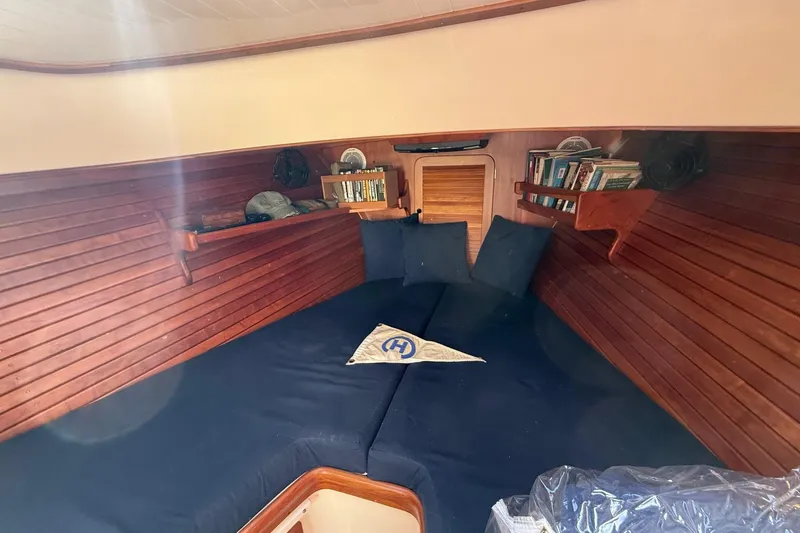 Timothy E Yacht Photos Pics 2001 Hinckley Classic Picnic Boat interior with cozy wooden cabin and blue cushions.