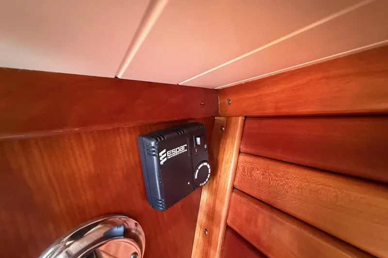 Timothy E Yacht Photos Pics Interior of 2001 Hinckley Classic Picnic Boat with Espar heating control on wooden panel.