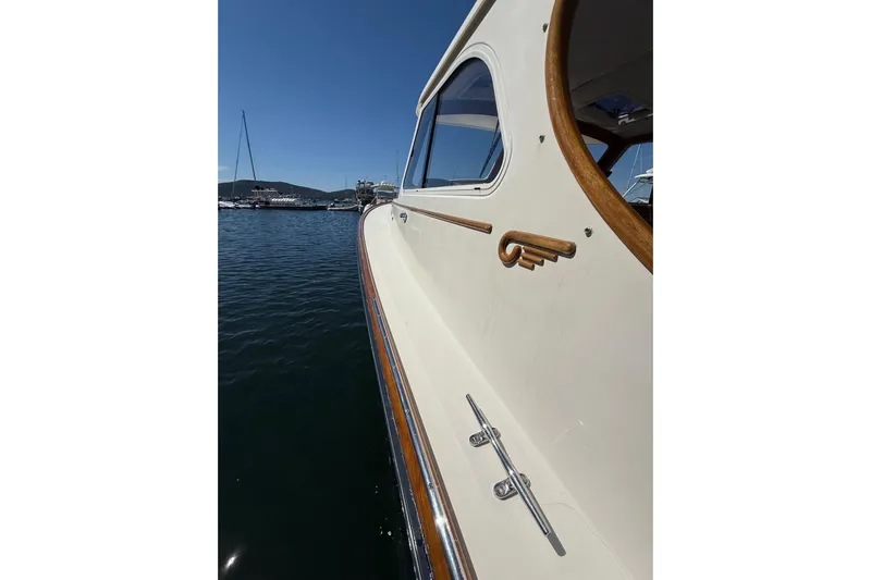 Timothy E Yacht Photos Pics 2001 Hinckley Classic Picnic Boat on calm water, showcasing elegant design and craftsmanship.