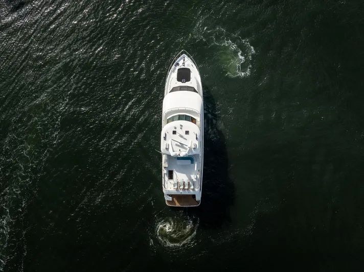 Jusmad Yacht Photos Pics Aerial view of 2005 Ocean Alexander 80 yacht cruising on open water.
