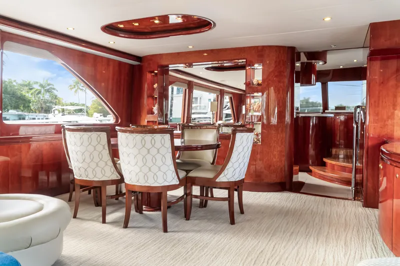 Jusmad Yacht Photos Pics Luxurious interior of 2005 Ocean Alexander 80 yacht with elegant dining area and wooden finishes.