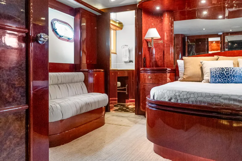 Jusmad Yacht Photos Pics Luxurious interior of 2005 Ocean Alexander 80 yacht with elegant wood finishes and plush seating.