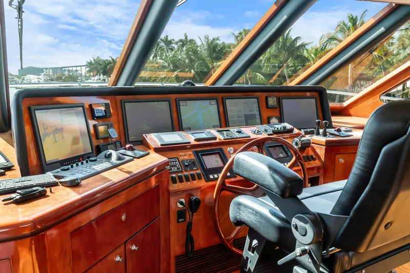 Jusmad Yacht Photos Pics Pilothouse of 2005 Ocean Alexander 80 yacht with advanced navigation equipment and luxurious wood finish.