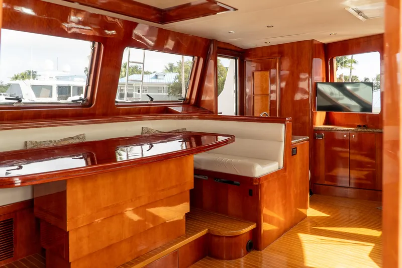 Jusmad Yacht Photos Pics Luxurious interior of 2005 Ocean Alexander 80 yacht with polished wood and modern amenities.