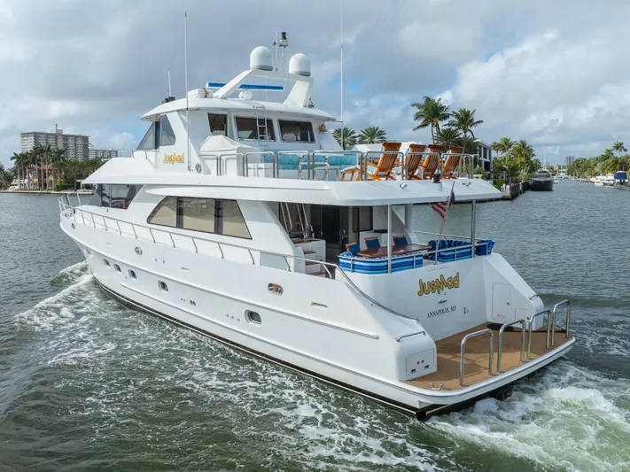 Jusmad Yacht Photos Pics Luxury 2005 Ocean Alexander 80 yacht cruising on a scenic waterway.