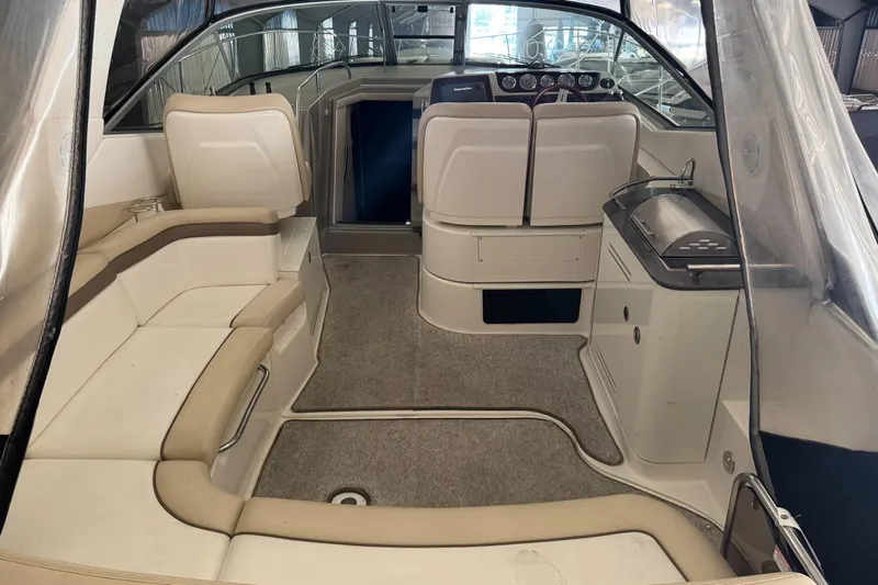  Yacht Photos Pics Interior of 2013 Sea Ray 370 Sundancer boat with seating and helm.