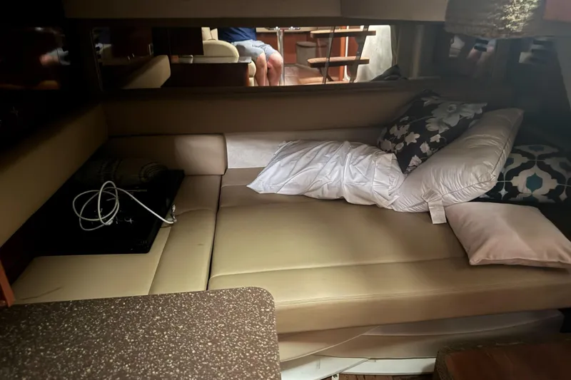  Yacht Photos Pics Interior cabin of 2013 Sea Ray 370 Sundancer with beige seating and decorative pillows.