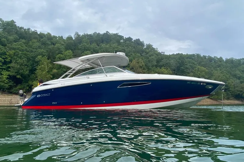  Yacht Photos Pics 2018 Cobalt R35 boat on a lake with forested background.