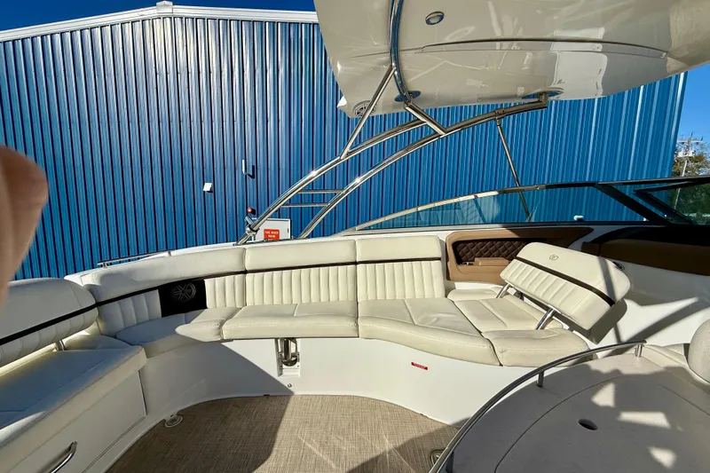  Yacht Photos Pics 2018 Cobalt R35 boat interior with white leather seating and blue metal siding.