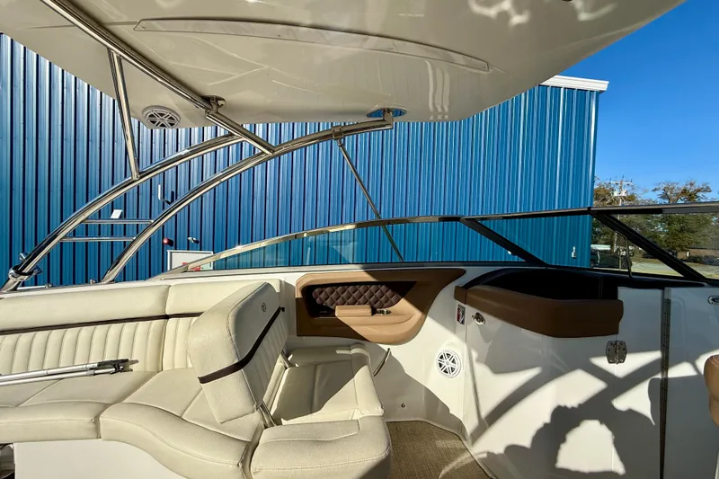  Yacht Photos Pics Interior of a 2018 Cobalt R35 boat with beige seating and blue exterior.