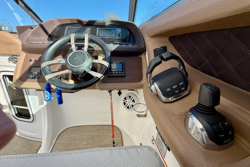  Yacht Photos Pics 2018 Cobalt R35 boat cockpit with steering wheel, controls, and dashboard.