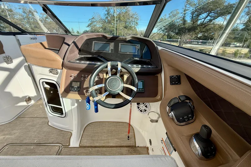  Yacht Photos Pics 2018 Cobalt R35 boat cockpit with modern steering and control panel.