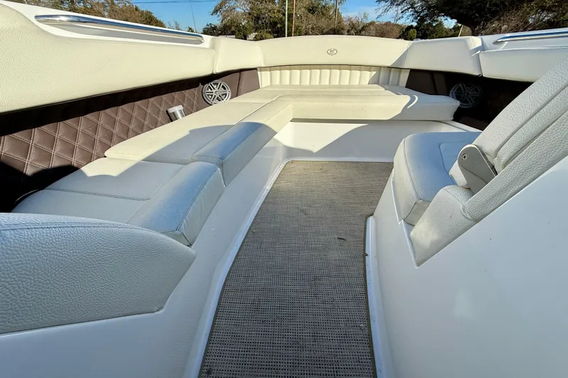  Yacht Photos Pics Interior of 2018 Cobalt R35 boat with white leather seating and carpeted floor.