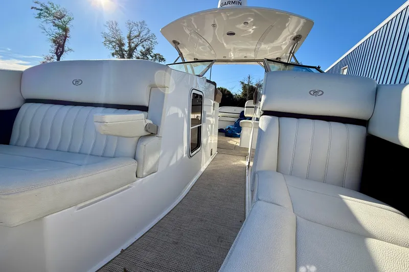  Yacht Photos Pics Luxurious interior of 2018 Cobalt R35 boat with white seating and sunny sky.