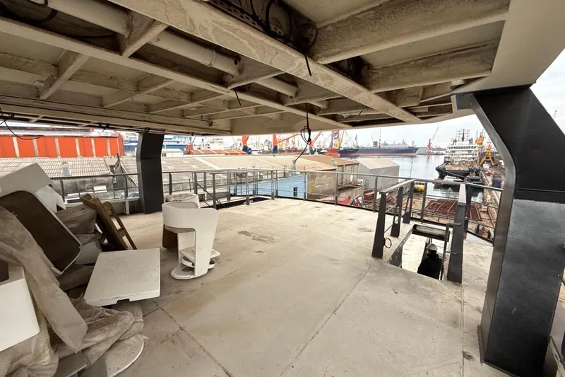 Nirvana Yacht Photos Pics Under-construction Soyaslan Custom 2027 yacht deck at a bustling shipyard.