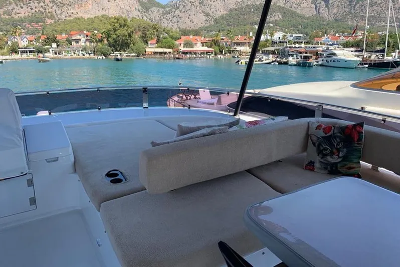  Yacht Photos Pics Luxurious Sirena 64 yacht deck with scenic waterfront view, 2021 model.