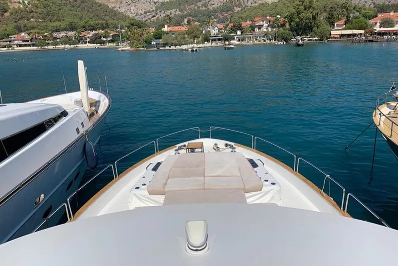  Yacht Photos Pics Bow view of 2021 Sirena 64 yacht docked in scenic marina.