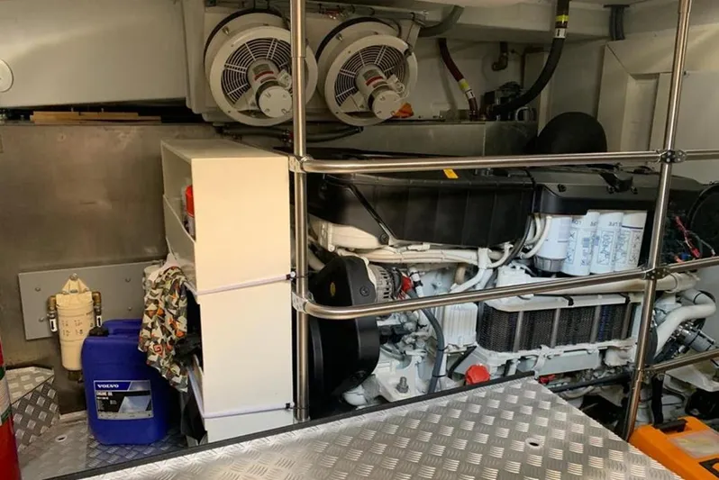  Yacht Photos Pics Engine room of a 2021 Sirena 64 yacht, featuring machinery and storage compartments.