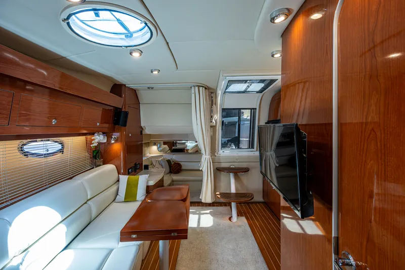  Yacht Photos Pics Luxurious interior of 2006 Regal Commodore 3560 IO yacht with elegant wood finishes.