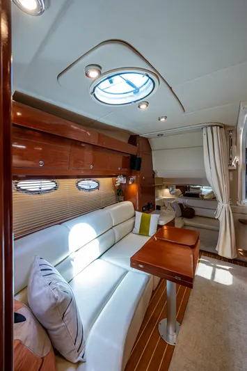  Yacht Photos Pics Interior of 2006 Regal Commodore 3560 IO yacht with elegant seating and wooden accents.