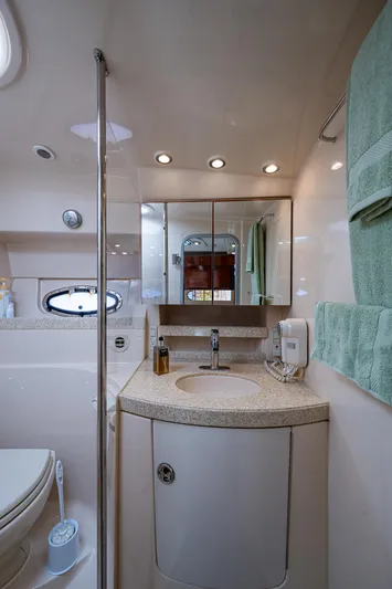  Yacht Photos Pics 2006 Regal Commodore 3560 IO bathroom with modern fixtures and elegant design.