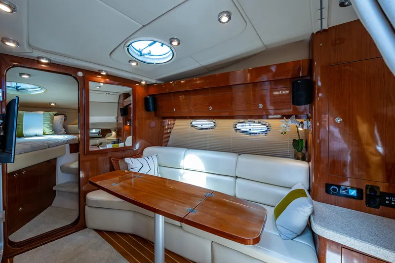  Yacht Photos Pics Luxurious interior of 2006 Regal Commodore 3560 IO yacht with elegant seating and wood finishes.
