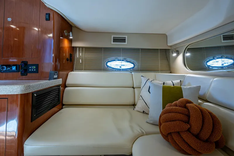  Yacht Photos Pics Interior of 2006 Regal Commodore 3560 IO yacht with plush seating and decorative pillows.