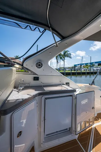  Yacht Photos Pics 2006 Regal Commodore 3560 IO yacht interior with kitchenette and waterfront view.