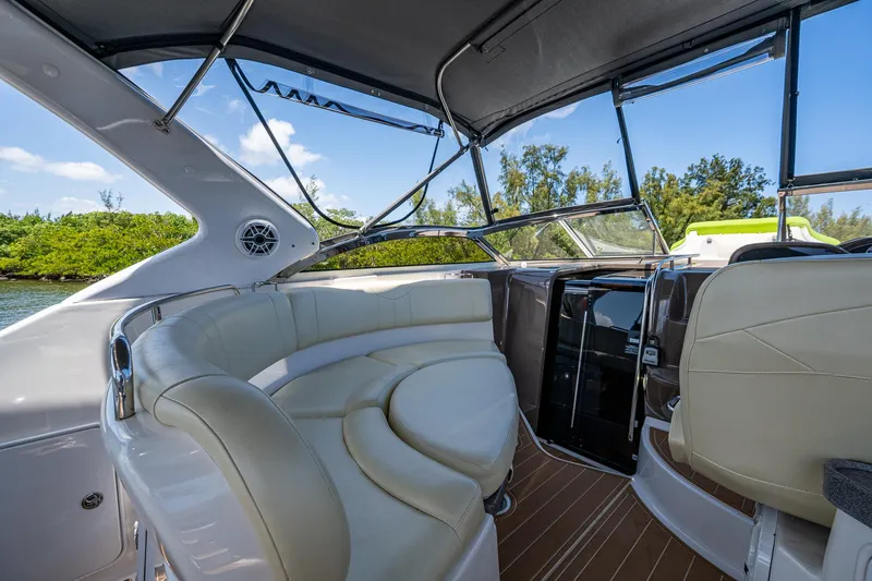  Yacht Photos Pics 2006 Regal Commodore 3560 IO boat interior with white seating and canopy.