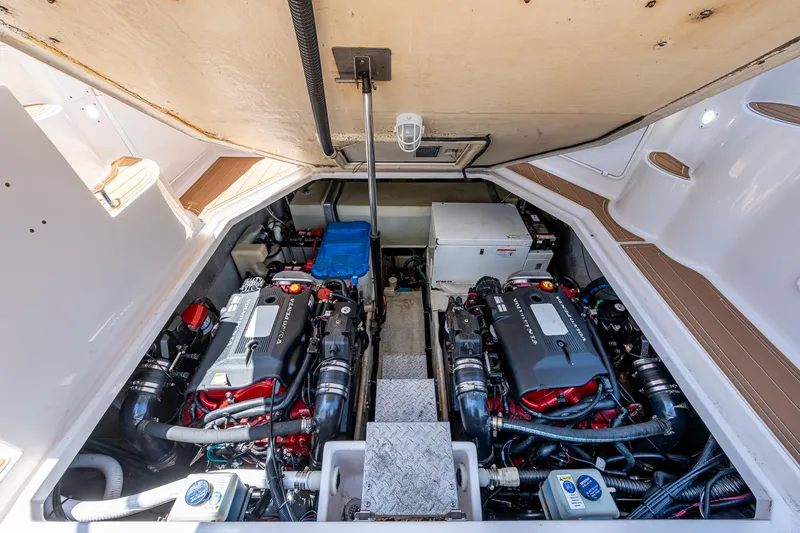  Yacht Photos Pics Engine compartment of 2006 Regal Commodore 3560 IO, showcasing dual engines and equipment.