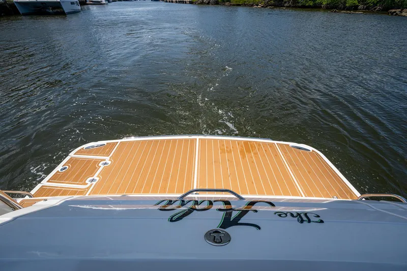  Yacht Photos Pics 2006 Regal Commodore 3560 IO boat stern on calm water.