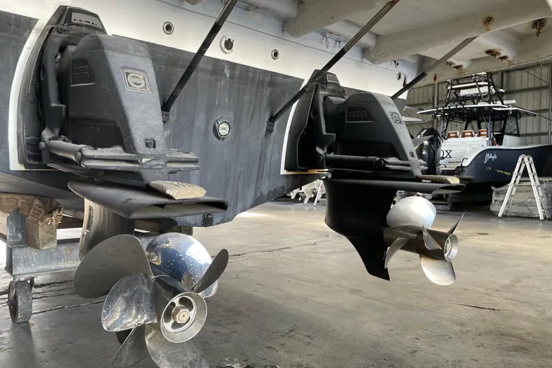  Yacht Photos Pics 2006 Regal Commodore 3560 IO boat propellers in a maintenance facility.