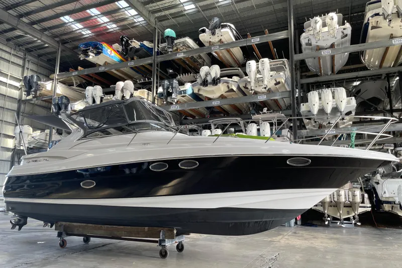  Yacht Photos Pics 2006 Regal Commodore 3560 IO boat in indoor storage facility.