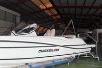 2025 Quicksilver 705 Open boat in a warehouse setting.