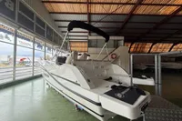2025 Quicksilver 705 Open boat displayed in a showroom, rear view.