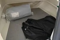 Interior cabin of 2025 Quicksilver 705 Open boat with storage bags.