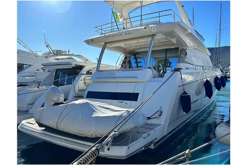  Yacht Photos Pics Luxury 2016 Prestige 680 Fly yacht docked in marina, rear view.