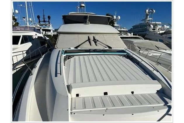  Yacht Photos Pics 2016 Prestige 680 Fly yacht docked in marina, showcasing sleek design and spacious deck.