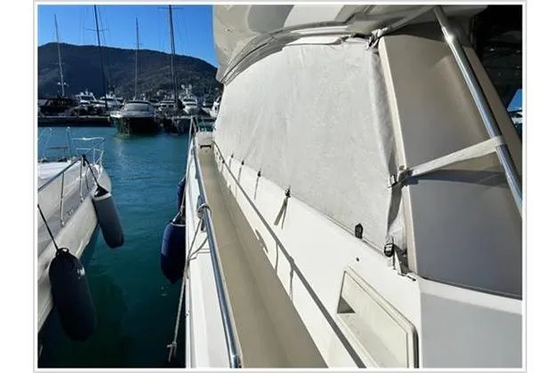  Yacht Photos Pics 2016 Prestige 680 Fly yacht docked in a marina, showcasing sleek design and luxury features.