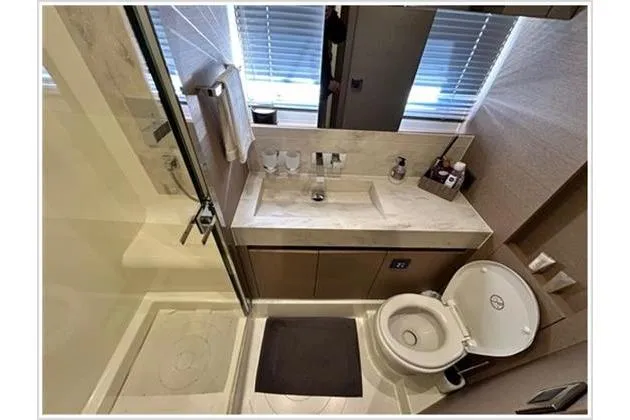  Yacht Photos Pics Luxurious bathroom in 2016 Prestige 680 Fly yacht with modern fixtures and elegant design.