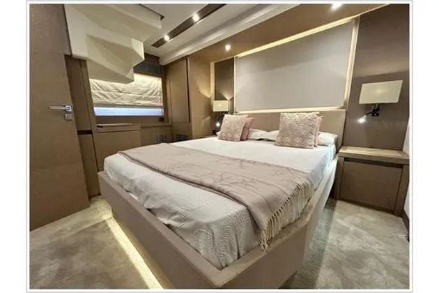  Yacht Photos Pics Luxurious bedroom interior of 2016 Prestige 680 Fly yacht with elegant decor.